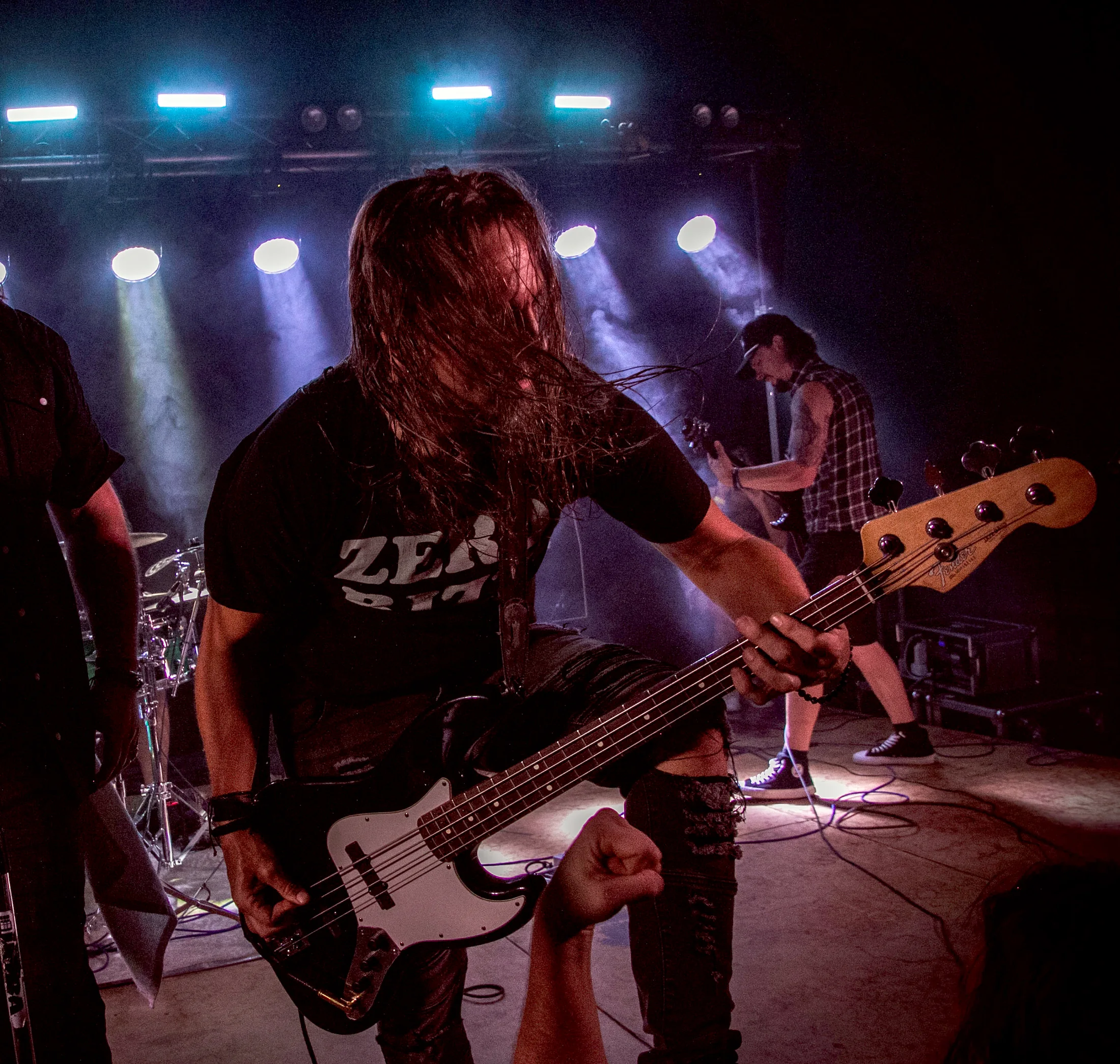 Claim To Flame bassist performing