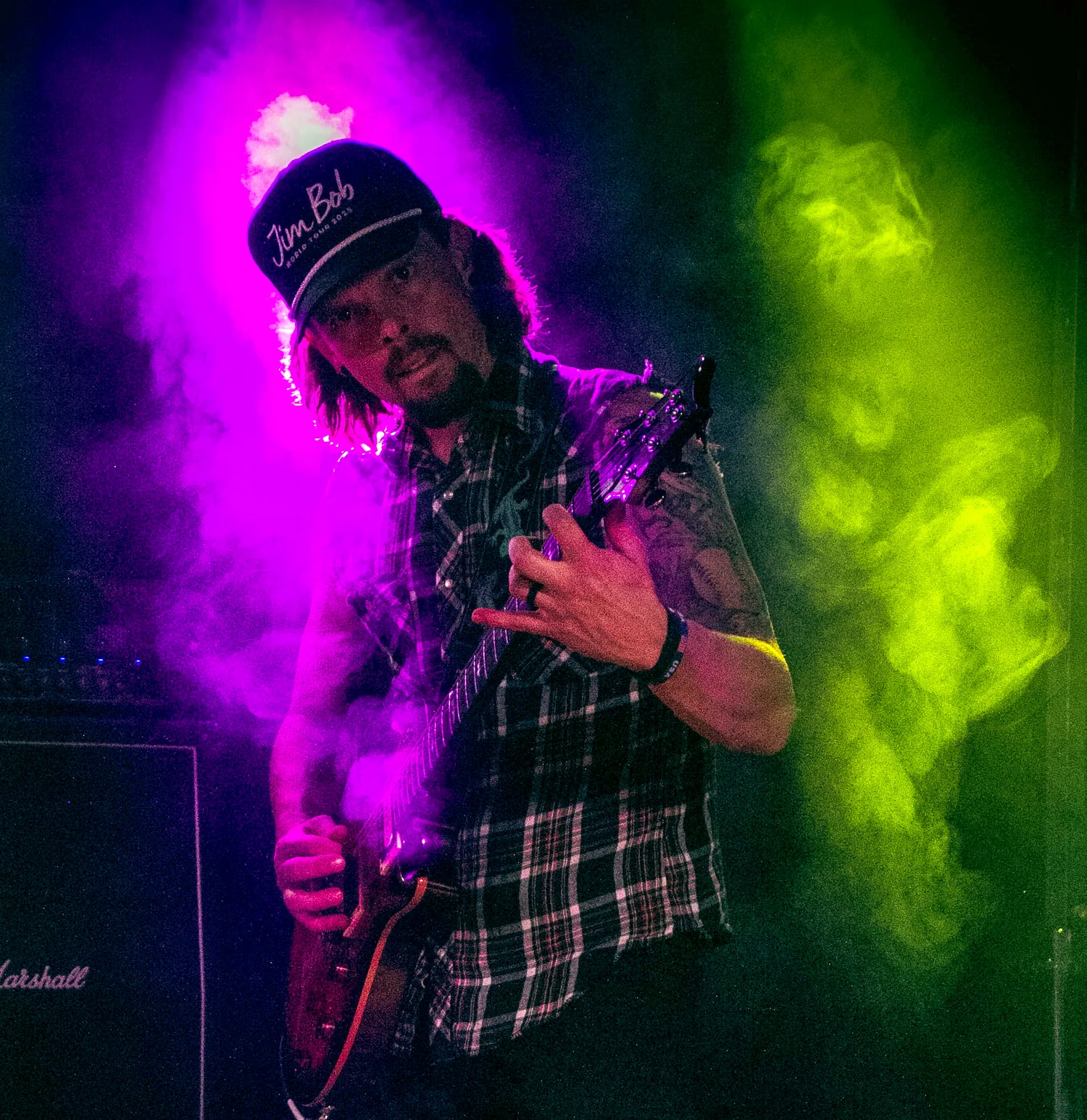 Claim To Flame guitarist performing in stage lights